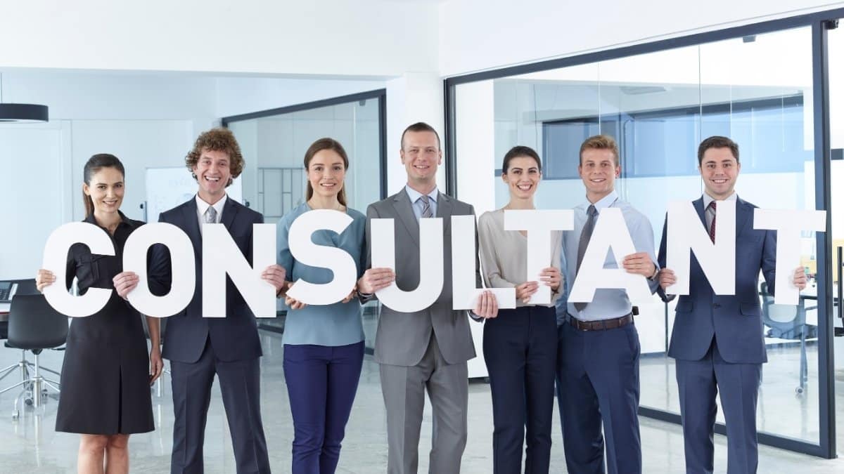 business men and business women standing in office and holding letter (consultant)